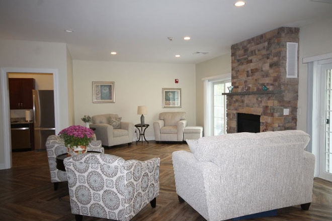 Community lounge with stone fireplace